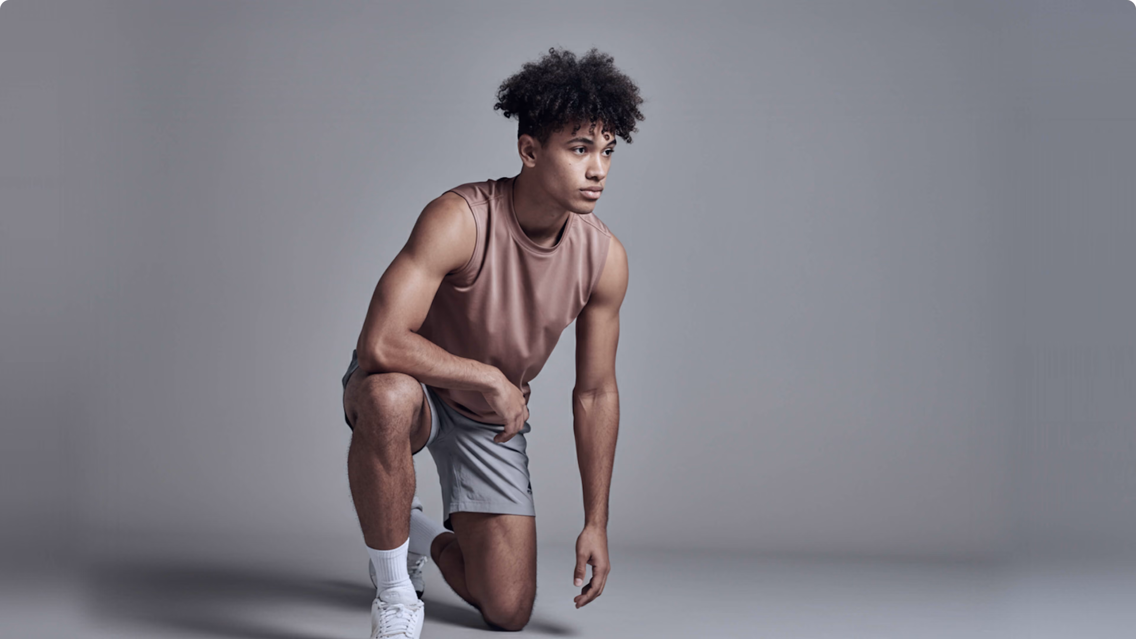 Athlete kneeling in a starting position